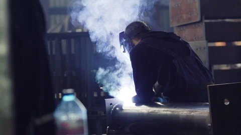 Welder welding with Sparks in workshop Stock Footage 121193028