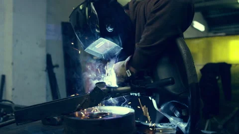 Welder welding in a workshop Stock Footage 279008047