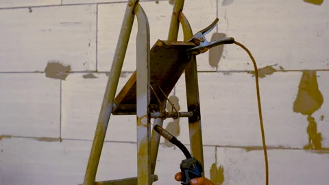 A welder welds metal. selective focus. Stock Footage 267864252