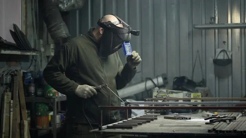 Welder welds metal structures in production Stock Footage 85551003