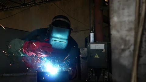  welder welds parts using a semi-automatic welding machine Stock-Footage 167922871