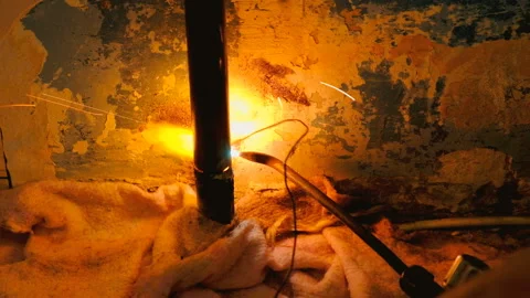 The welder welds the pipe. Stock Footage 95682970