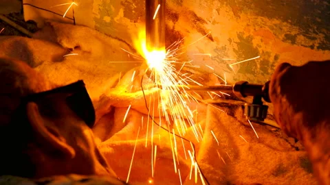 The welder welds the pipe. Stock Footage 95683025
