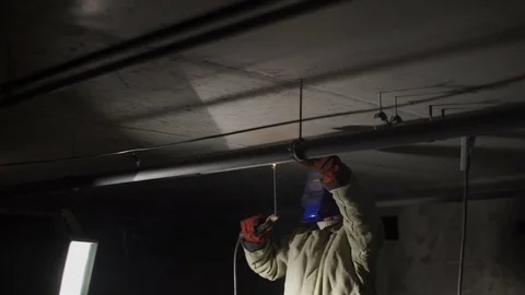 Welder welds the pipes Stock Footage 82295510