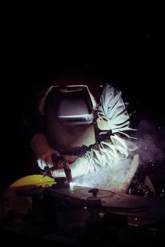 Welder at work on black background Foto stock