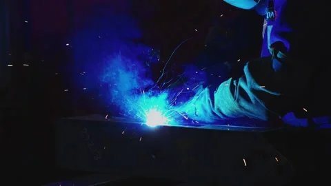 Welder at Work with Bright Blue Sparks and Metal Marked 2218 Stock Footage 296507313