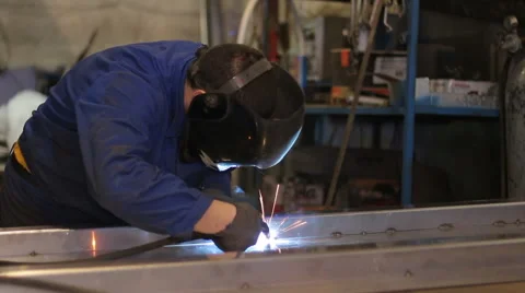 Welder at work in metal industry Stock Footage 63440414