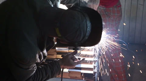 Welder at work in metal industry Stockbeeldmateriaal 64973022