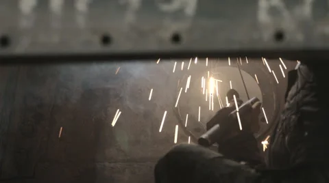 Welder at work. repairing machine Stock Footage 64546722