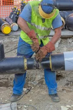Welder worker grinding the weld Stock Photos