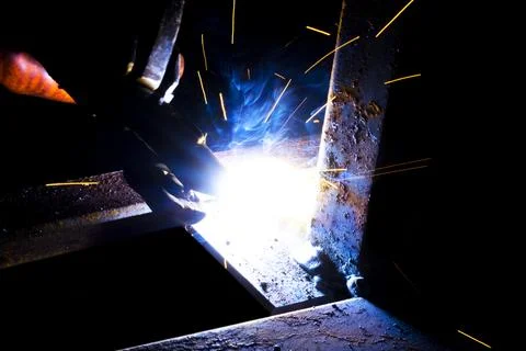 Welder worker performs jump welding. Man welder in protective gloves perfor.. Stock Photos