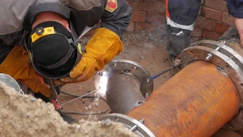 Welder worker welding pipe by electrode. close-up Stock Footage 160328535