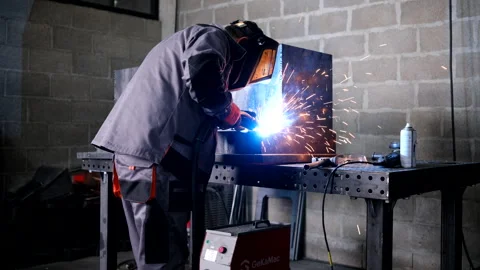 Welder working and soldering iron with mask - slider shot Stock Footage 286126229