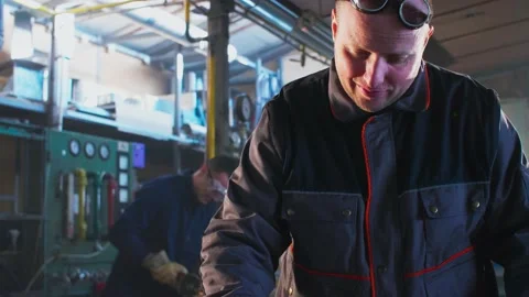 Welder working with autogenous welding tool in workshop Stock Footage 148513737