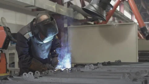 Welder is working on the factory Stock Footage 130743832