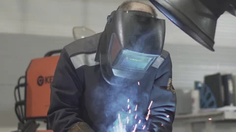 Welder is working on the factory. Stock Footage 130743872