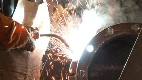 Welder working on flange for new line manufacturing Видео 346635341
