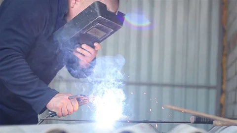 Welder Working in the garage Stock Footage 77569108