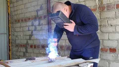 Welder Working in the garage Stock Footage 77618221