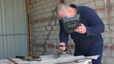 Welder Working in the garage Stock Footage 77618261