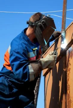 A welder working at height Stock Photos