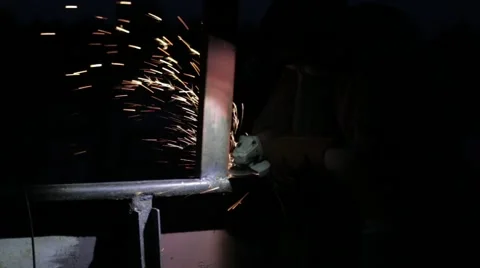 Welder working an industrial sander grinder for metal Stock Footage 53880469