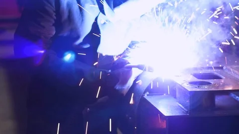 Welder working with metal in a factory Stock Footage 103285053