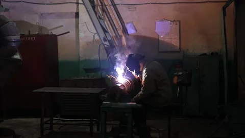 Welder working with metal Stock Footage 170539784