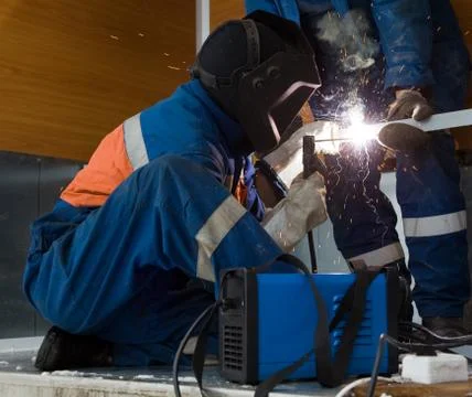 Welder working with a metal structure Stock-Fotos
