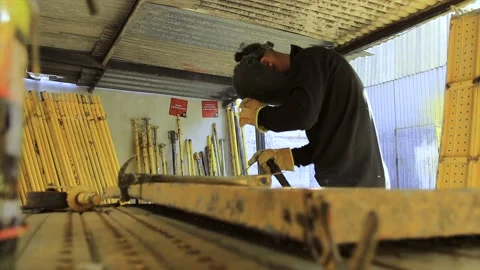 Welder working on spark metal workbench Stock Footage 155366164
