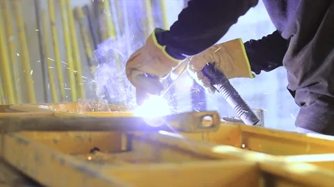 Welder working on spark metal workbench Stock Footage 155366169