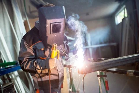 Welder working in workshop Stock Photos