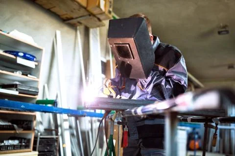 Welder working in workshop Stock Photos