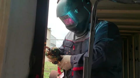 The welder works with a welding machine. Stock Footage 310652795
