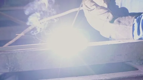 Welder in the workshop welds metal construction close-up Stock Footage 104263343