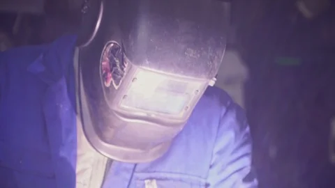 The welder in the workshop welds metal construction Stock Footage 104263386
