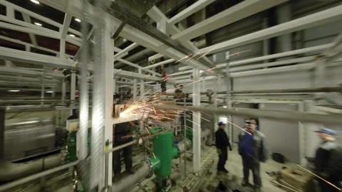 Welders assemble modular building frame in well-lit workshop Stock Footage 328954823