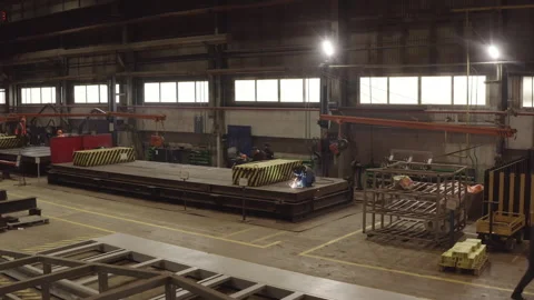 Welders assemble structural components on steel platform Stock Footage 329008657