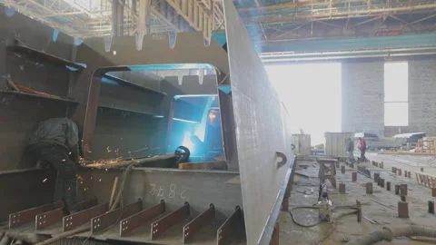 Welders welding large steel sections steel box girder of bridge. Welders weld Video stock 313938261