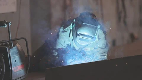 Welders welding large steel sections, structures, steel boxes and trusses Stock Footage 313938697