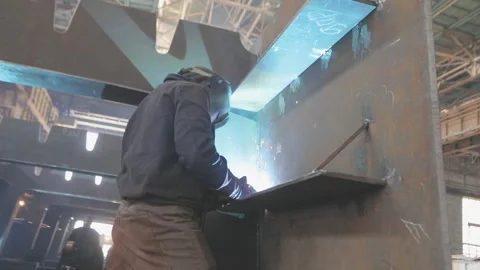 Welders welding large steel sections, structures, steel boxes and trusses Stock Footage 317100319