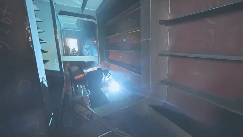 Welders welding large steel sections steel box girder of bridge. Welders weld Stock Footage 317374449