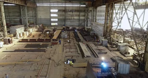 Welders welding large steel sections, structures, steel boxes and trusses Stock Footage 319938831