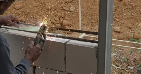 Welding action in industrial setting workshop environment detailed process Stock Footage 331753757