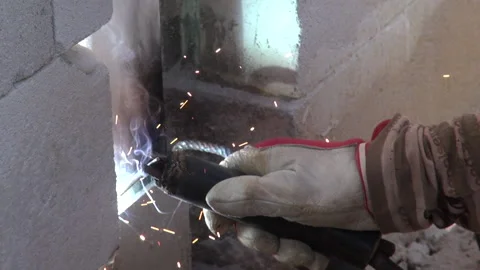 Welding and a welder doing his job Stock Footage 239768219