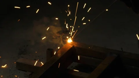 The welding with arc light and smoke of fire resulting from burning carbon Stock Footage 112854153