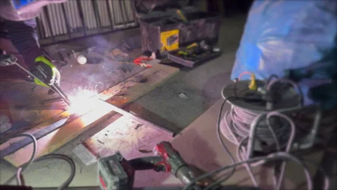 Welding with argon or electrode, using a welding machine. Sparks and flashe.. Stock Footage 241506186