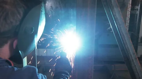 Welding from behind Stock Footage 60924236