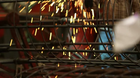Welding Bore Pile Cage with Sparks Stock Footage 34338377