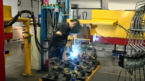 Welding of components for automobile production Stock Footage 96404738